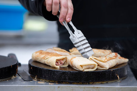 Pancakes stuffed cooked on a hot frying pan. Bake pancakes.