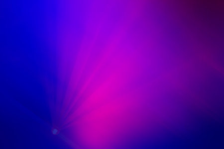 Blurred pink rays from the stage light on a purple background. Purple pink gradient.