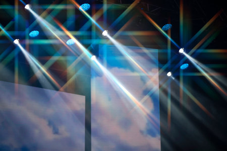 Multi-colored light beams from stage equipment.の写真素材