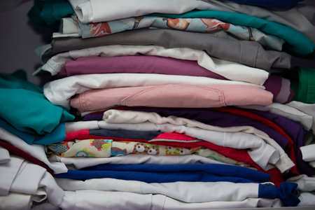 A stack of medically ironed clean clothes.