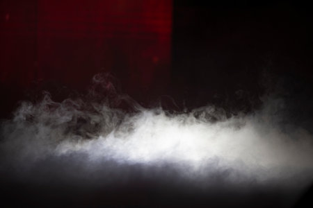 Smoke stage illuminated by a beam of light.の写真素材