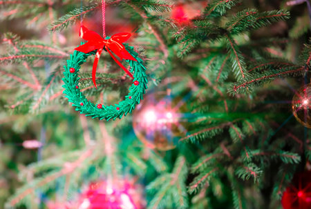 Christmas background with a beautiful Christmas toy and light beams from a garland.の写真素材