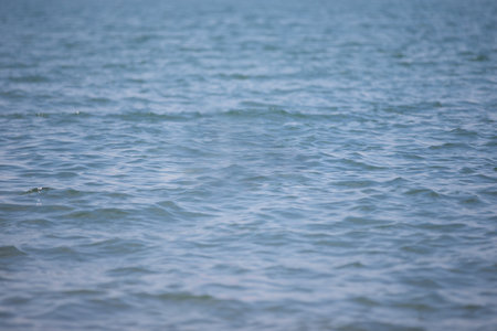 Blue light sea water texture with slight wave.