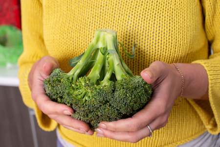 Hands holding cabbage tossed. Healthy green vegetables.の写真素材