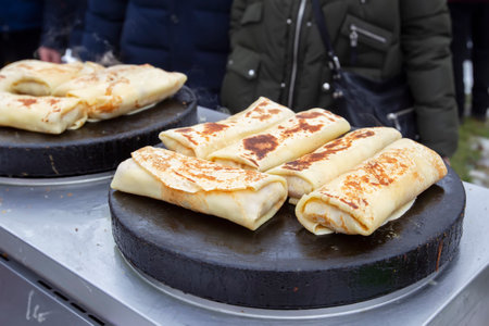 Street food. Fried pancakes in a street cafe.の写真素材