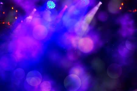 Abstract blurred stage background with blue and purple bokeh spots.の写真素材