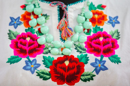 Fragment of an embroidered shirt in Slavic ethnic style.