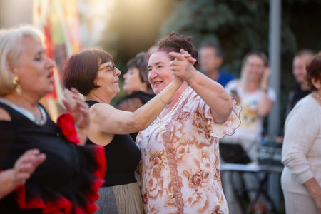 July 29, 2023. Belarus. Staraia Belitsa village.Elderly women pensioners dance on a summer day.