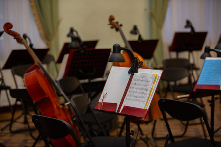 Music stands and instruments set for practice.
