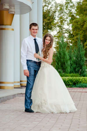 Wedding Day. Happy Beautiful Bride in the Arms of the Groomの写真素材