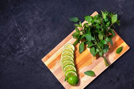 Fresh Mint and Lime on Dark Stone Table. Copy Space For Your Textの写真素材