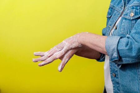 Close-up Woman Very Carefully Washing Hands with Soap During Pandemic. Most Important Method Anti-Coronavirus.の写真素材