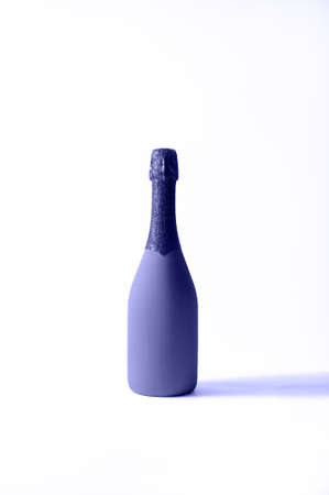 Festive Minimalistic Champagne Bottle on Light Background. Creative Concept. Very Peri - Color of the year 2022の写真素材