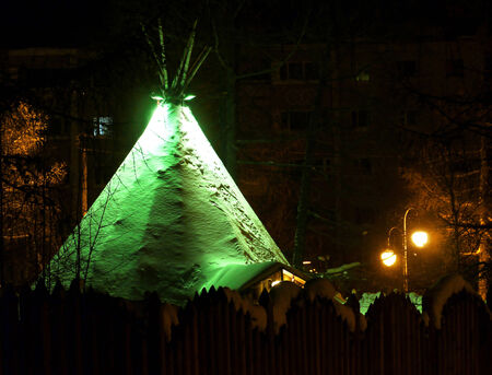 NADYM, RUSSIA - FEBRUARY 28, 2013: New Year - a holiday in Nadym, Russia - February 28, 2013. Festive street decorations. Beautifully illuminated building and trees. Far north, Nadym.のeditorial素材