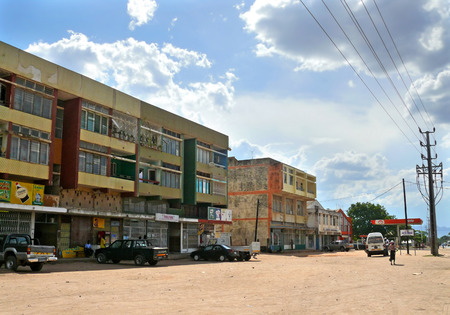 NAMPULA, MOZAMBIQUE - 6 DECEMBER 2008  the Village  A residential building in Nampula, Mozambique - 6 December 2008  Transport parked near and coming on the road  Strangers villagers go about their business  のeditorial素材
