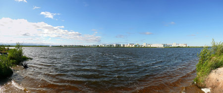 Nadym, Russia - July 18, 2008: the panorama of the city on the river Nadym in Nadym, Russia - July 18, 2008.の写真素材