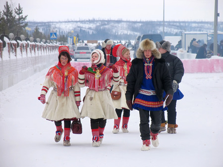 Nadym, Russia - March 3, 2007: the national holiday, the day of the reindeer herder in Nadym, Russia - March 3, 2007. Unknown group of people walking along the road.のeditorial素材