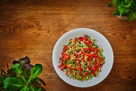 salad of peppers, cucumbers and corn on a dishのeditorial素材