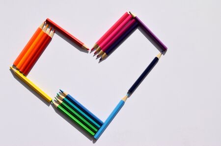 heart of colored pencils on a white background with copy spaceの写真素材