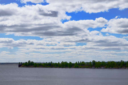 river bay surrounded by green trees under blue sky with clouds Rest walks on the water