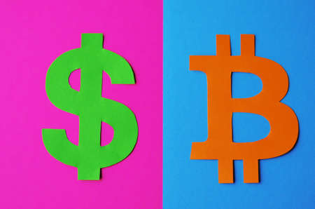 The dollar sign on a pink background and a sign of bitcoin on a blue background close-up. Conceptual collage about cryptocurrency in the style of cyberpunkの写真素材