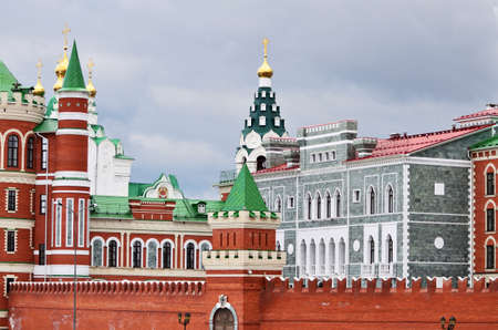 A combination of architectural styles is a grey stone building and a red brick wall. Russia Yoshkar-Ola 01.05.2021のeditorial素材