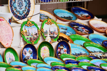 A counter with souvenir magnets of green and blue with the sights of the city. Russia Kazan 24.04.2021のeditorial素材