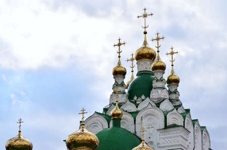 Golden domes with crosses of the Orthodox Church. Russia Yoshkar Ola 01.05.2021のeditorial素材