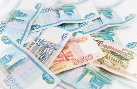 Russian money background. Ruble banknotes and coins of different denominations closeup