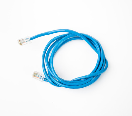 Patch cord blue network cable with molded RJ45 plug, isolated on a white backgroundの写真素材