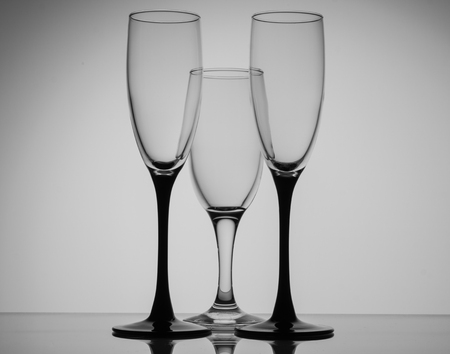 Silhouette champagne glasses black and white on grey backgroundの写真素材
