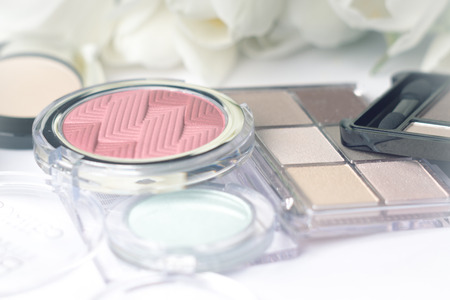 Abstract blurred background, cosmetics set and tulips flowers on white. Macro shot, Shallow depth of field, defocusedの写真素材