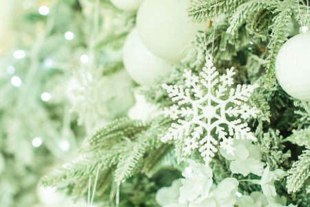 christmas decoration, postcard. on the tree a snowflake, balls and a garland. chalcedony, celadon green.の写真素材