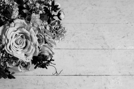 bouquet of flowers on a wooden background. black and white tinted. Selective focus. Place for text. copy spice.の写真素材