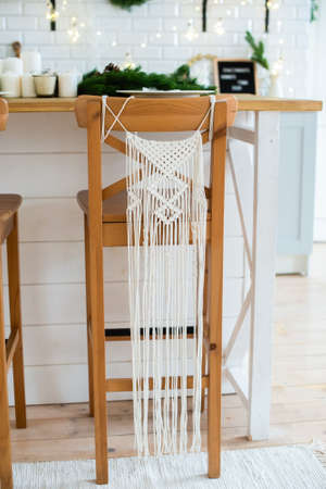 macrame. living room decor. macrame on a wooden chair. cozy rustic styleの写真素材
