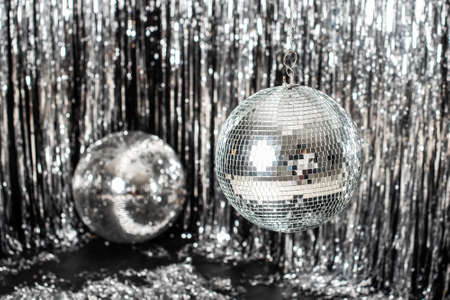 Festive background. disco ball on beige and silver background. Christmas. Wedding. Birthday.の写真素材