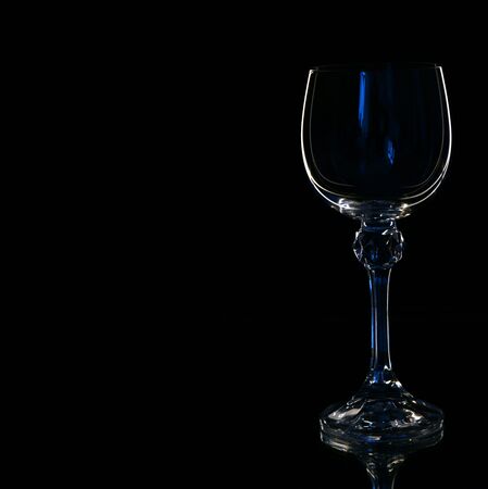 Wine in beautiful vintage crystal glasses on black wall background, with copy space. Wine list, bar drink menu, wine boutique or degustation, square crop conceptの写真素材