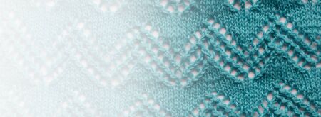Abstract knitting fabric background. Turquoise blue White texture background from merino knitted...