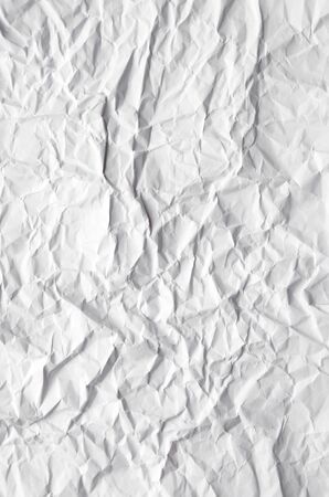 White Abstract crumpled paper background. Top view of old Paper textures backgrounds for design, invitation, decorative paper texture vertical concept.の写真素材