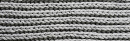 Abstract knitting fabric background. Gray texture background from merino knitted blanket,...