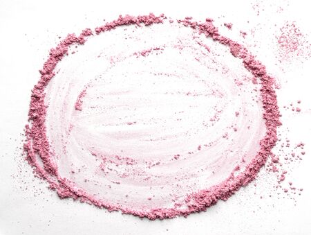 Vibrant pink powder and blush traces forming a round frame. A circle template for a makeup fashion business card, flyer, poster design with copy spaceの写真素材
