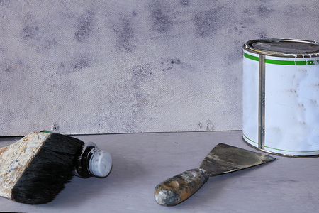 Painting the wall during repair. Repair work in a new house, brush, paint and color for the necessary workの写真素材