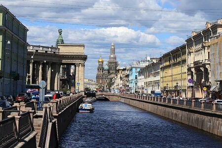 Russia, St. Petersburg, June 29, 2019: The Cathedral of the Resurrection of Christ on the blood during restoration work, boats with tourists visiting the sights of the cityのeditorial素材