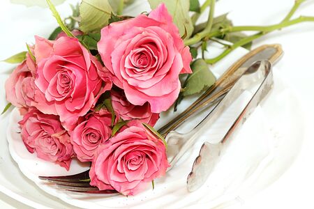Greeting card for Valentine's Day or Women's Day. Roses on a white background on the festive table. Festive background February 14thの写真素材