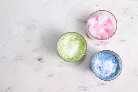 An assortment of colorful latte Japanese tea, match blue and green, pink moon milk. A fashionable healthy drink has anti-inflammatory properties, helps to reduce weight, helps detoxify the body,の写真素材