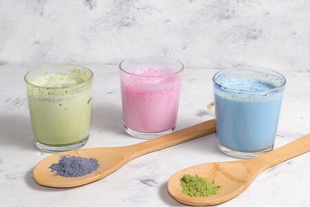 An assortment of colorful latte Japanese tea, match blue and green, pink moon milk. Fashionable healthy drink has anti-inflammatory properties, helps to reduce weight, helpsの写真素材