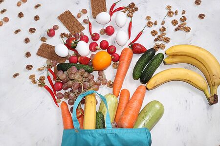 Useful natural products in an eco bag, the concept of a healthy lifestyle, zero waste. Vegetables,...