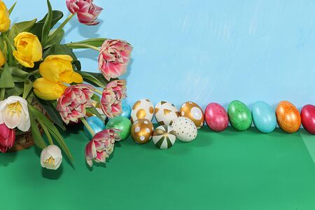 Decorated golden eggs on a trendy blue background. Minimal holiday concept. Happy Easter background,...