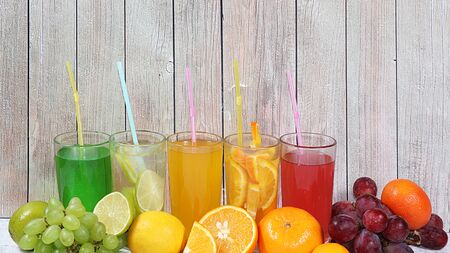 Citrus cider, juice, drinks and ingredients on a wooden table. The concept of detox diet and weight loss, healthy and natural foods. Summer drinks, vitamins C,の写真素材