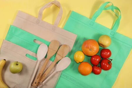 Healthy natural products in an eco bag for boosting immunity, the concept of a healthy lifestyle, zero waste. Vegetables, fruits in cloth packaging, diet. Banner for the store. No plastic.の写真素材